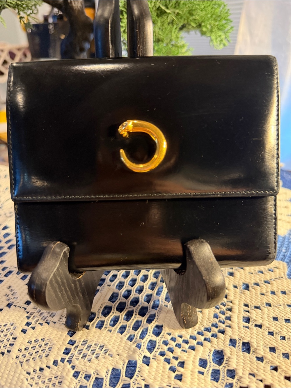 Cartier Black Leather With Gold-Tone Panther Ring.